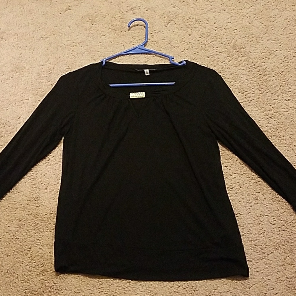 Black blouse with gold pendant
